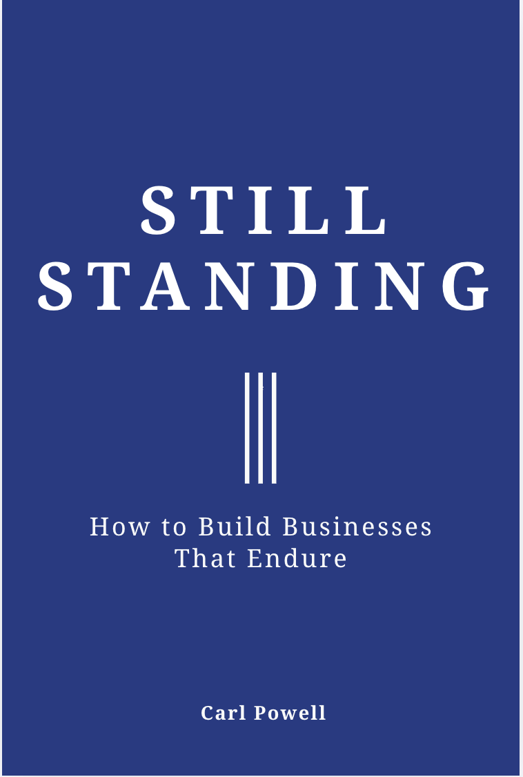 Book cover of 'Still Standing: How to Build Businesses That Endure' by Carl Powell on a blue background.