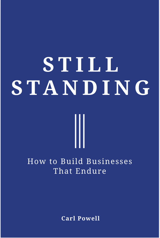 Book cover of 'Still Standing: How to Build Businesses That Endure' by Carl Powell on a blue background.